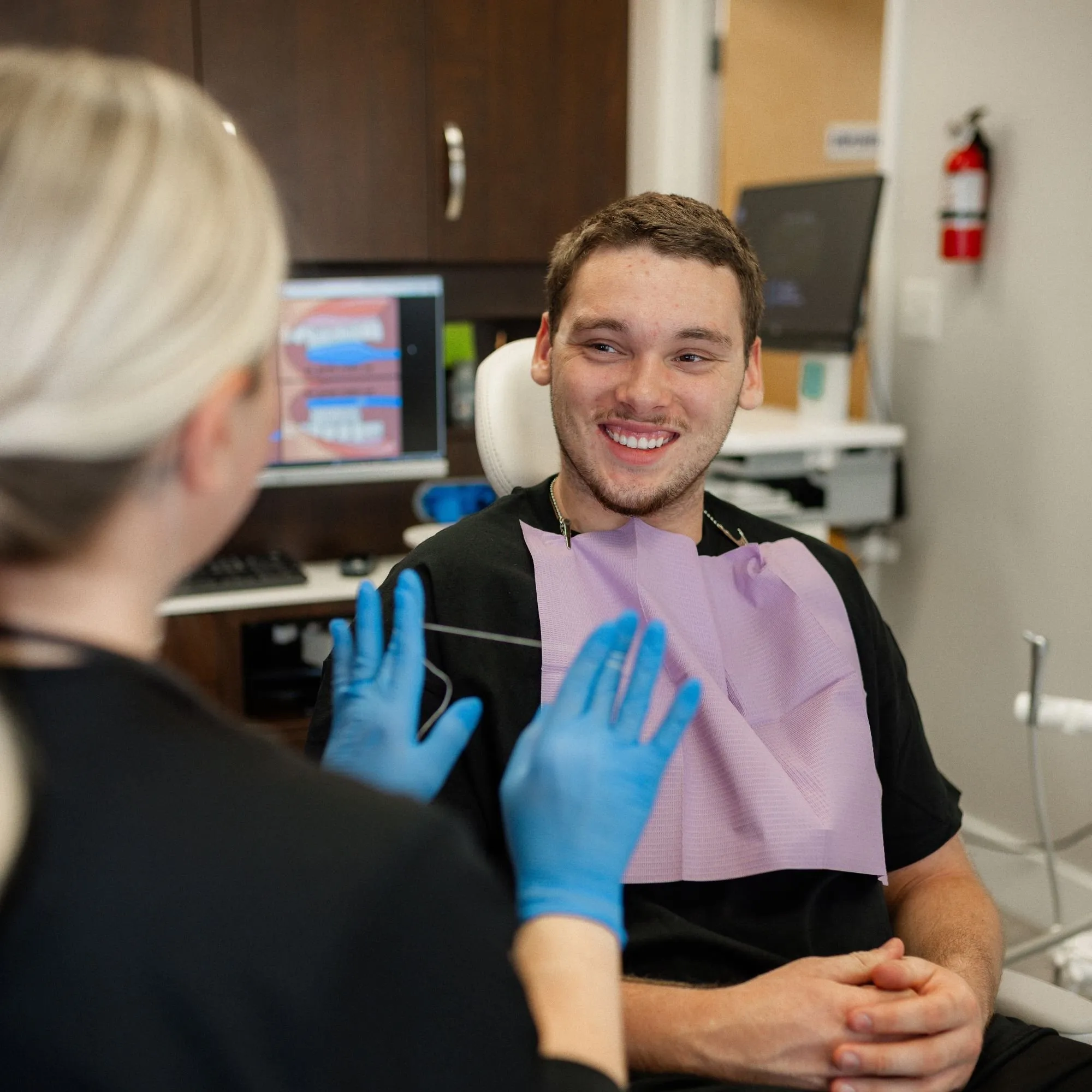 Hygienist at Highland Lakes Dental talking with a patient before a routine cleaning and exam